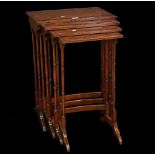 A Regency style mahogany nest of four tables on turned supports, the largest 50cm wide x 71cm high,