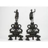 A pair of Victorian style patinated figural chenets, modelled as Diana the Huntress and David,