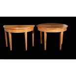 Linley, a pair of modern demi-lune foldover tables on tapering square supports,