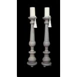 A pair of large modern grey painted wooden candlesticks, 154cm high.