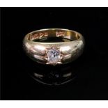 An 18ct gold and diamond set band ring,