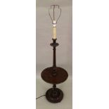 A mahogany turned column combined standard lamp and wine table and a mahogany footstool,