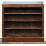 A late Victorian mahogany stained pine dwarf open fronted bookcase,