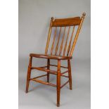 A pair of Edwardian oak and elm spindle back Windsor chairs.