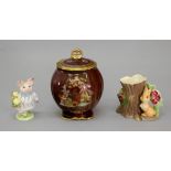 A Crown Devon rouge royale chinoiserie pattern jar and cover, 16cm high,