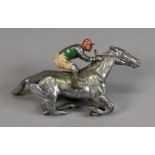 A chromium plated horse with jockey up car mascot, 13cm wide.