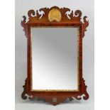A 'Chippendale Revival' mahogany and gilt fret carved frame wall mirror, 60cm high x 40.5cm wide.