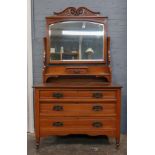 An Art Nouveau walnut dressing table fitted with three drawers, 106cm wide x 50cm deep x 182cm high.