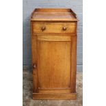 A Victorian mahogany pot cupboard, with tray top, drawer and cupboard below,