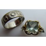 A 9ct gold ring with centre stone, possibly spinel, and six small diamonds, size N,
