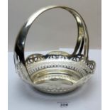 An unmarked white metal basket with pierced decoration and fixed handle, approx 10.