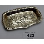 A silver pin tray embossed with classical scene,