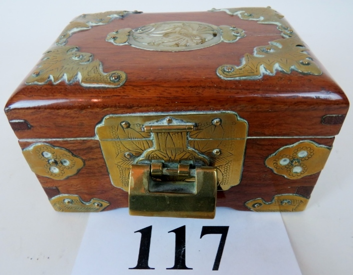 An early/mid 20th Chinese hardwood box with chased brass mounts and applied jade coloured plaque