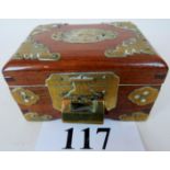 An early/mid 20th Chinese hardwood box with chased brass mounts and applied jade coloured plaque