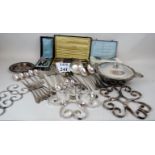 A collection of French plated items to include folding hinged trivets, horn handled knives, tureen,