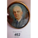 An oval framed portrait miniature watercolour of a suited gentleman,