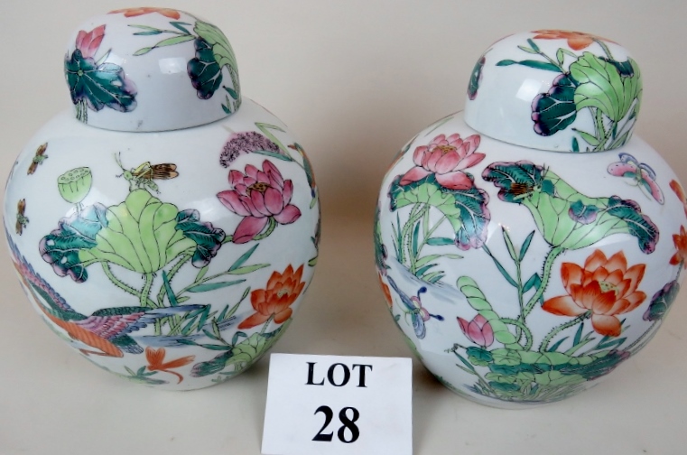 A pair of Chinese Famille Rose porcelain jars with domed covers, probably 20th century exports,