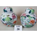 A pair of Chinese Famille Rose porcelain jars with domed covers, probably 20th century exports,