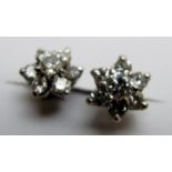 A pair of diamond cluster earrings,
