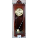 A 19th century continental glazed mahogany cased Vienna type wall clock, pendulum,