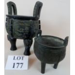 Two Chinese archaic-type bronze tripod censors, but of later construction,