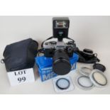 An Olympus OM 10 camera with desirable manual adapter, lense, boxed Cosina 100-300 mm MF Zoom lens,