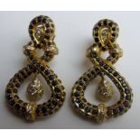 A large pair of sapphire and diamond drop earrings inset with 52 diamonds (approx 1ct each earring),