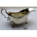 A silver sauce boat with hoof feet, Birmingham 1925, approx 4.