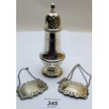 A silver sugar caster, Birmingham 1970 and two silver decanter labels, both fully hallmarked,