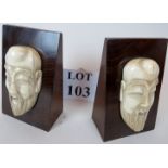 A pair of Asian carved bone and exotic hardwood bookends, c.