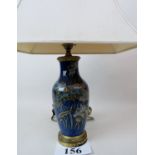 A decorative antique gilt-metal mounted ceramic table lamp,