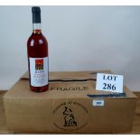 12 bottles of rosé wine being Domaine du Merchien,