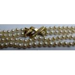 A two strand pearl necklace with 18ct gold and diamond clasp,