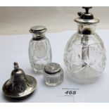 A silver top scent bottle, engraved with a flowers London 1915, a sterling topped atomiser,