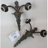 A pair of decorative cast-metal twin-branch wall lights, c.