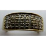 A 9ct gold ring set with three bands of diamonds,
