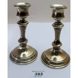 A pair of silver candlesticks, (one repaired), Birmingham 1949,