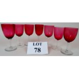A set of 7 Victorian cranberry glass wine glasses est: £30-£50