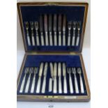 A set of twelve silver and mother of pearl fruit knives & forks, (one a/f), Sheffield 1911, boxed,