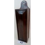 A Georgian mahogany wall mounted candle box, with sliding door,