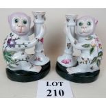 A pair of decorative second half 20th century Chinese monkey figure candlesticks, approx 22 cm high,