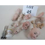 A collection of 19th century and early 20th century porcelain dolls head and doll parts est: