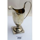 A modern silver helmet shaped cream jug, Birmingham 1975, slight dent,