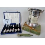 A silver plated wine cooler, an onyx cigar box with hinged lid, an onyx handled cigar cutter,
