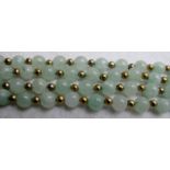 Vintage 48" long pale jade coloured green bead necklace, alternate gold tone beads, (unmarked),