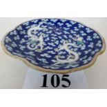 A 19th century Chinese porcelain dish, the lobbed circular form on a spreading circular foot,