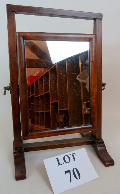 A 19th century mahogany adjustable ladies vanity mirror of elegantly small proportions,