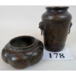 A Chinese bronze vase with incised inscription and twin mask handles, age unknown,