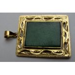 A 14ct gold and jade square pendant,
