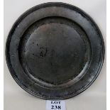 An early 18th century large pewter charger,
